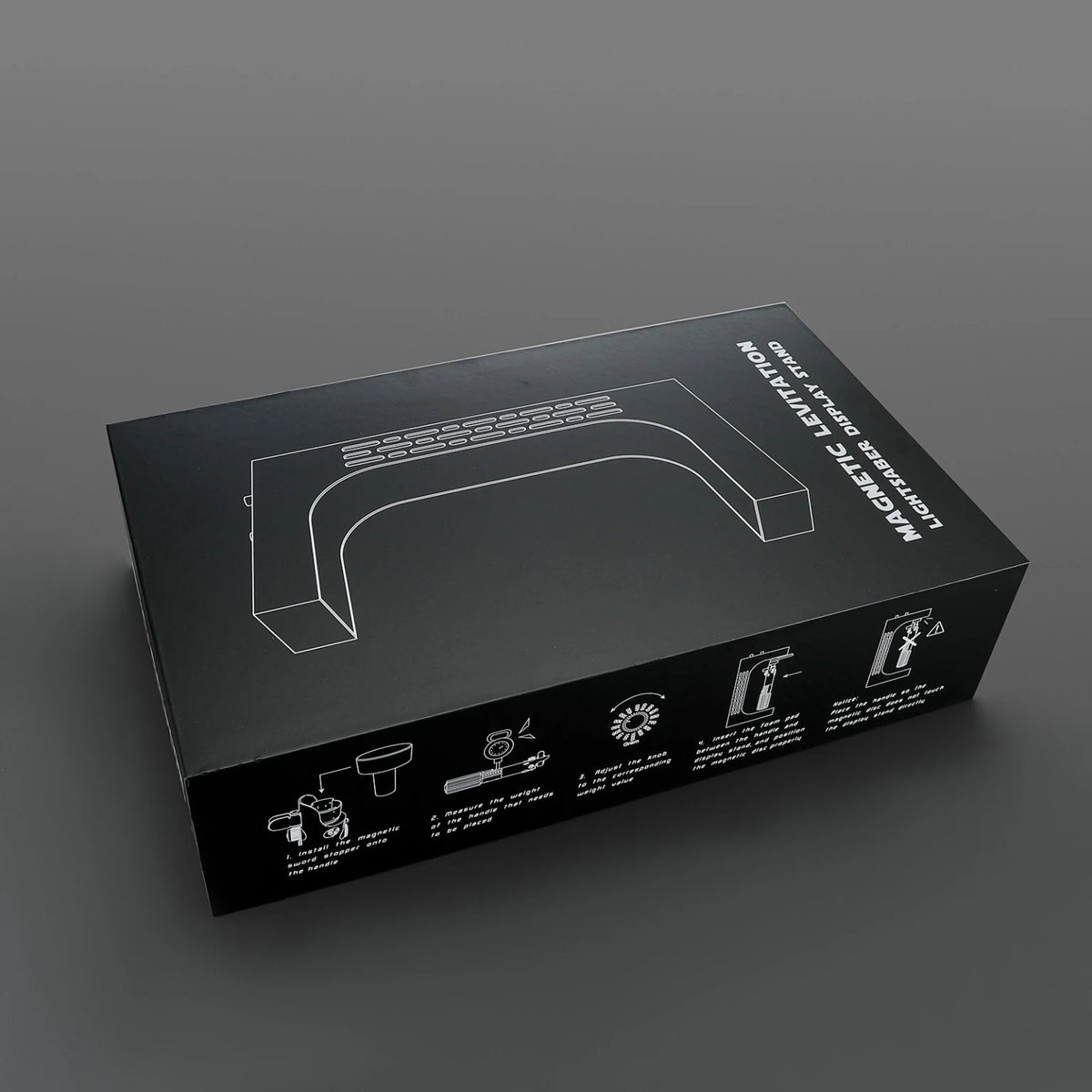 Retail packaging for the white levitating saber stand